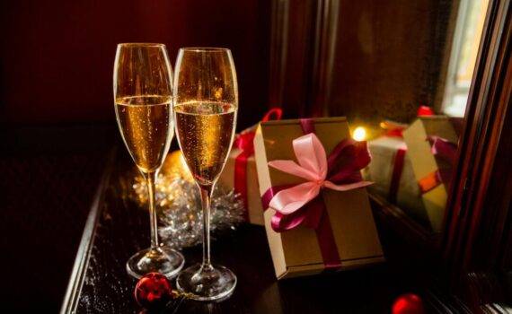 table with champagne glasses and gifts